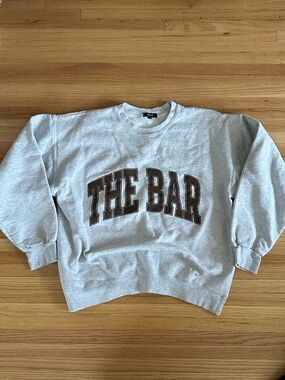 The Bar Gray Crewneck Sweatshirt with Brown Chest Applique
